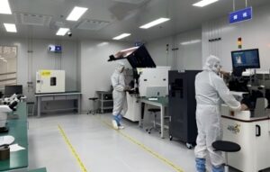 Keda's R & D team in white suits working on drone jammer modules in the lab