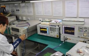 Keda worker using test equipment to test drone jammer - related components