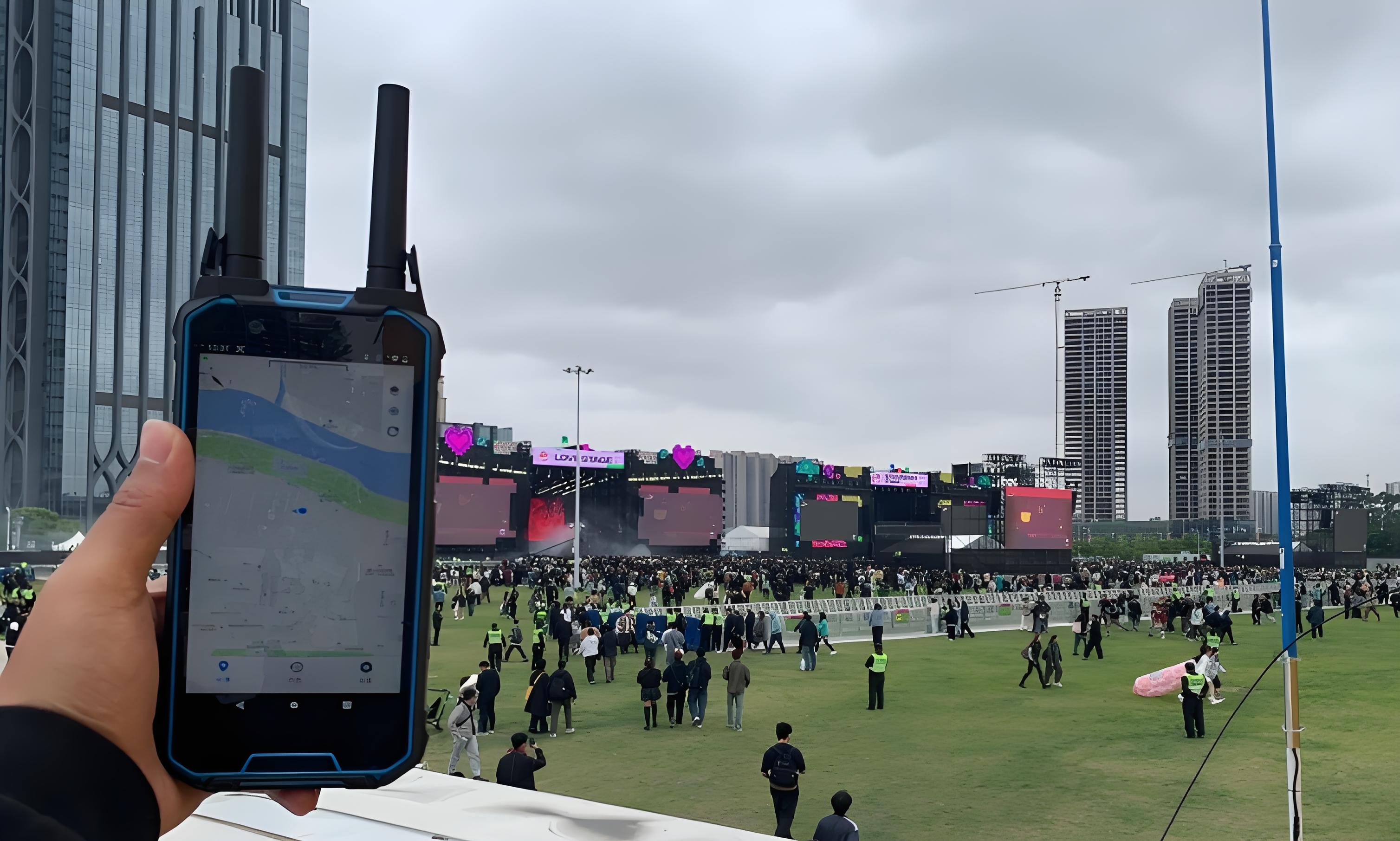 Rugged device with antennas showing map at an outdoor music festival